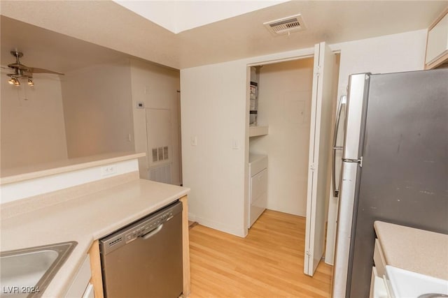 kitchen featuring sink, light hardwood / wood-style flooring, ceiling fan, appliances with stainless steel finishes, and white cabinetry