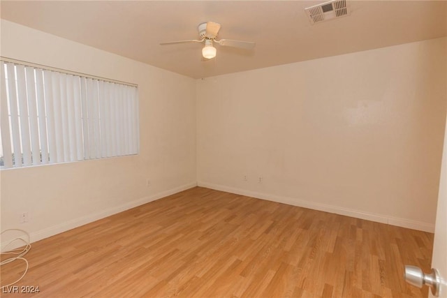 spare room with ceiling fan and light hardwood / wood-style floors