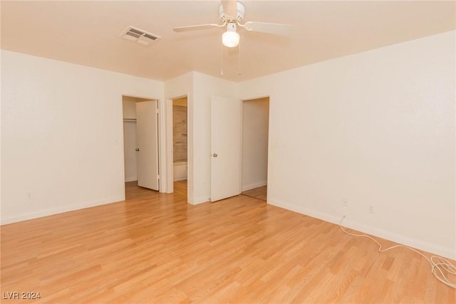 unfurnished room featuring ceiling fan and light hardwood / wood-style floors