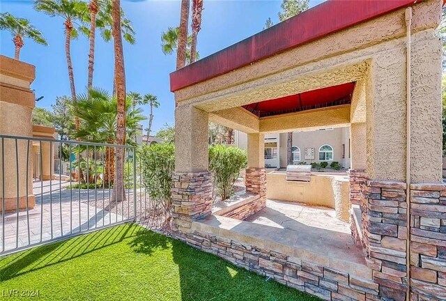 view of patio featuring exterior kitchen