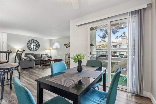 dining space with a healthy amount of sunlight and wood-type flooring