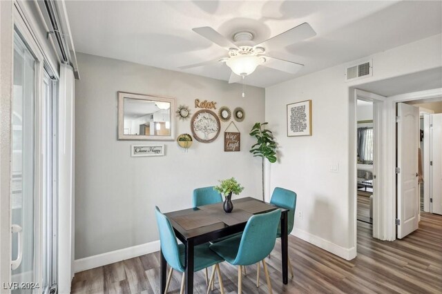 dining area featuring hardwood / wood-style flooring, ceiling fan, and a healthy amount of sunlight