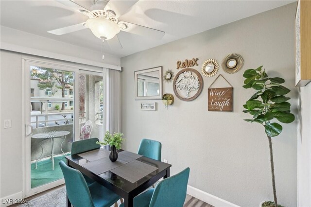 dining room with hardwood / wood-style flooring and ceiling fan