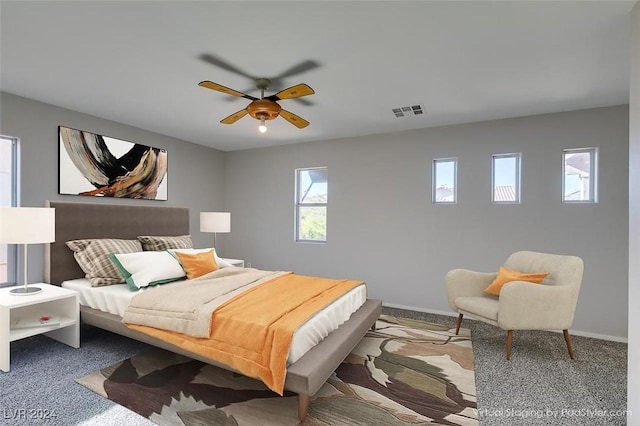 carpeted bedroom with ceiling fan