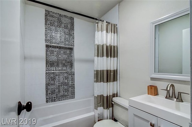 full bathroom with vanity, toilet, and shower / bath combo with shower curtain