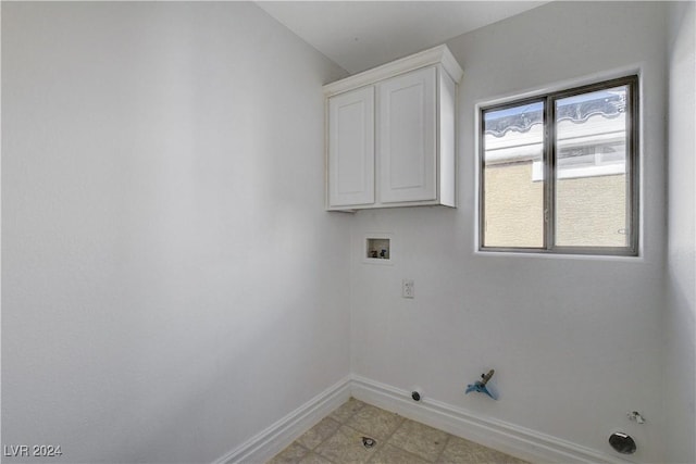 washroom with gas dryer hookup, washer hookup, and cabinets