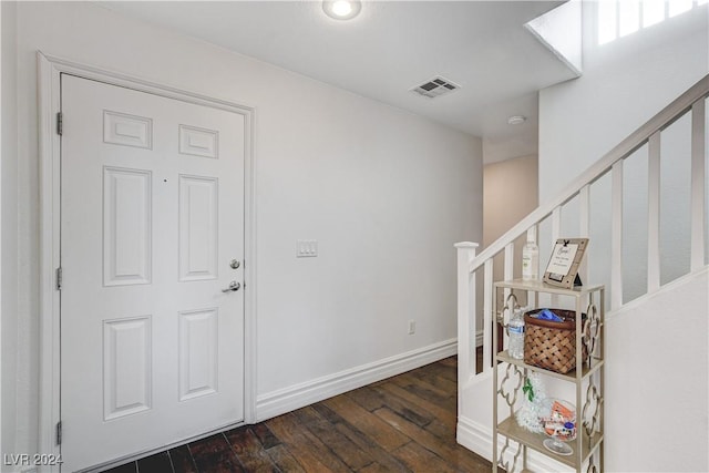 entryway with dark wood-type flooring