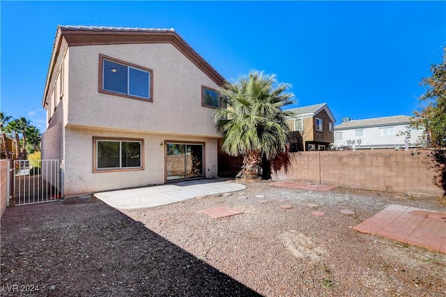 rear view of house featuring a patio area