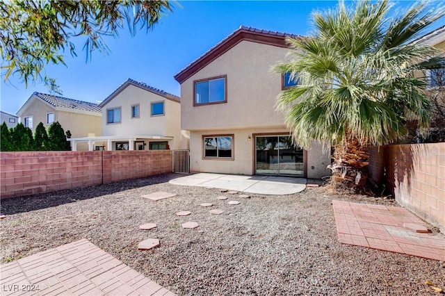 rear view of property with a patio area