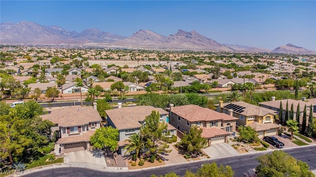 birds eye view of property featuring a mountain view