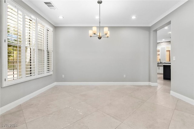 tiled spare room featuring a notable chandelier, ornamental molding, and a wealth of natural light