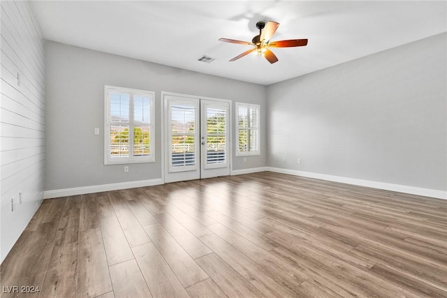 unfurnished room featuring ceiling fan and hardwood / wood-style flooring