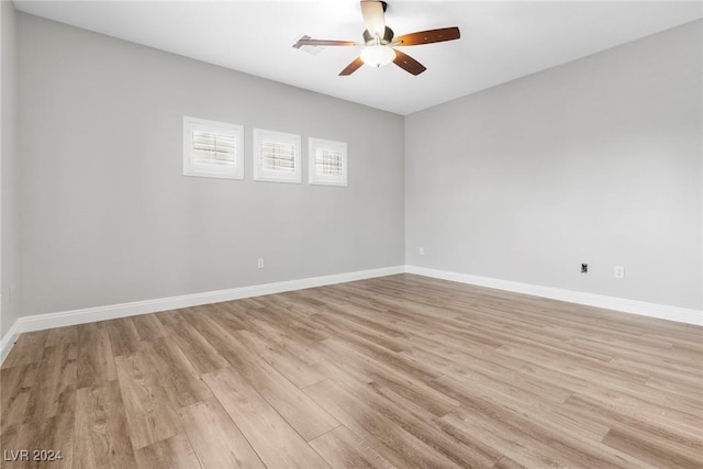 empty room featuring ceiling fan and light hardwood / wood-style floors