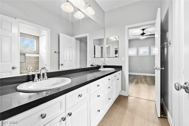 bathroom featuring ceiling fan and vanity