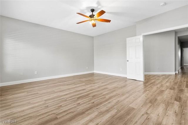 empty room featuring ceiling fan and light hardwood / wood-style floors