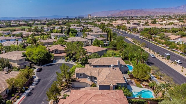 birds eye view of property with a mountain view