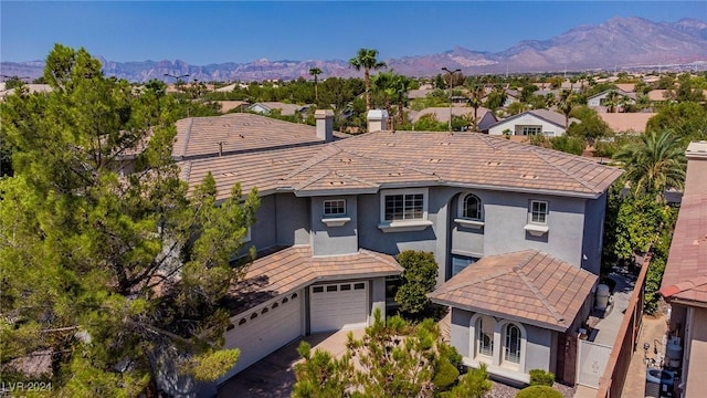 birds eye view of property featuring a mountain view