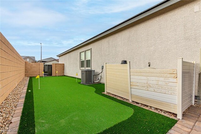 view of yard with central AC unit