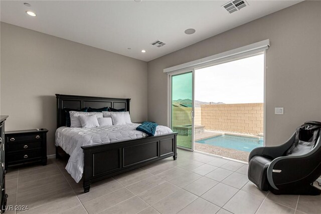 bedroom with light tile patterned flooring and access to outside