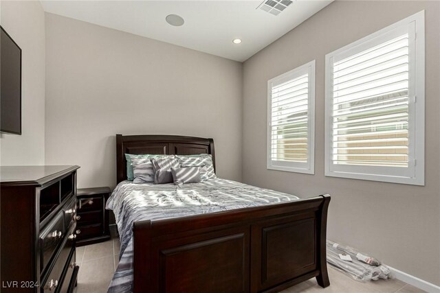 bedroom with light tile patterned flooring