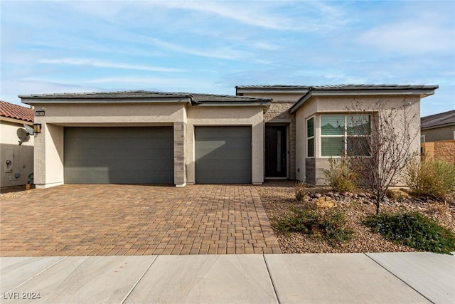 prairie-style home with a garage