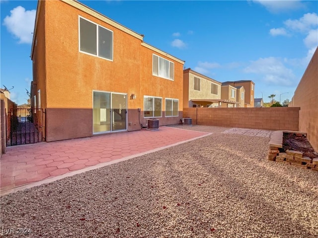 back of house featuring a patio and cooling unit