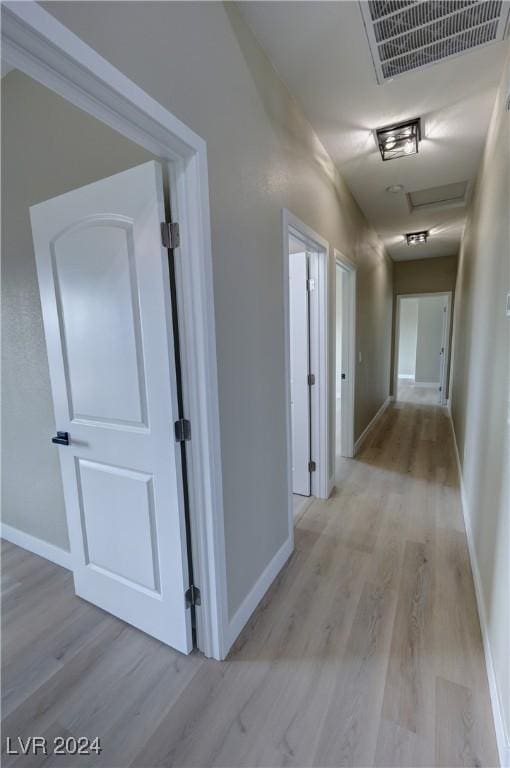 hallway featuring light hardwood / wood-style flooring