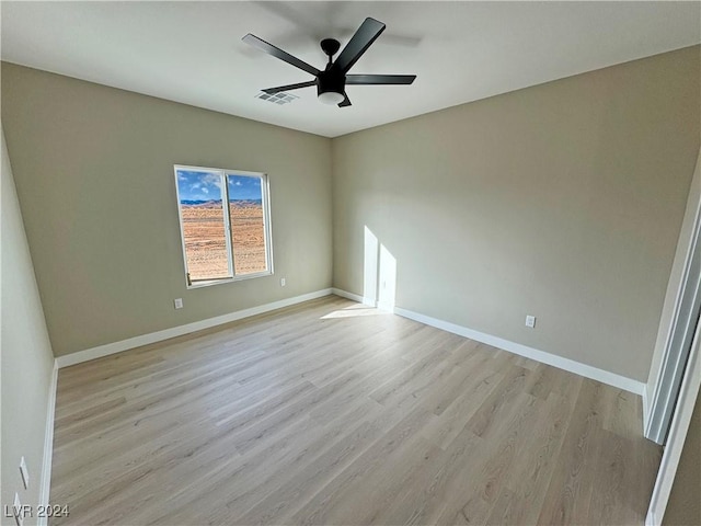 unfurnished room featuring ceiling fan and light hardwood / wood-style flooring