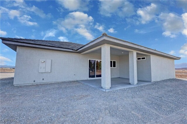 back of property featuring a patio