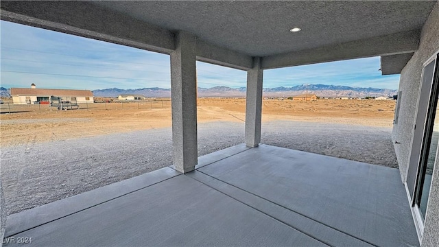 view of patio / terrace with a mountain view