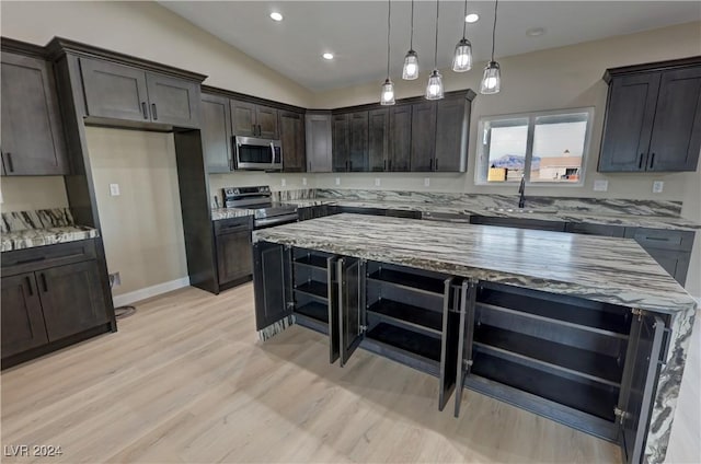 kitchen with light stone counters, stainless steel appliances, pendant lighting, a kitchen island, and lofted ceiling