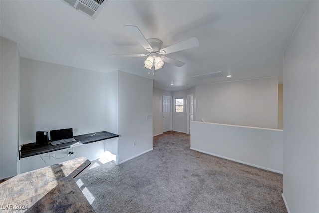 interior space with ceiling fan and light carpet