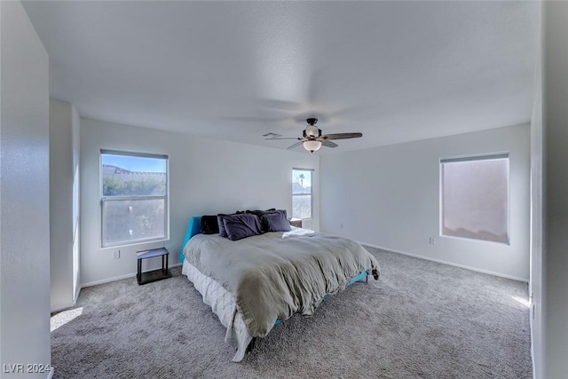 bedroom featuring ceiling fan and light colored carpet