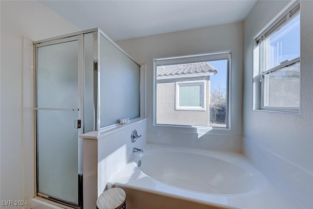 bathroom with shower with separate bathtub