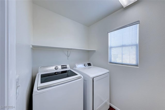 laundry area with independent washer and dryer