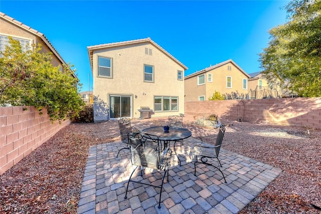 back of property with a patio area