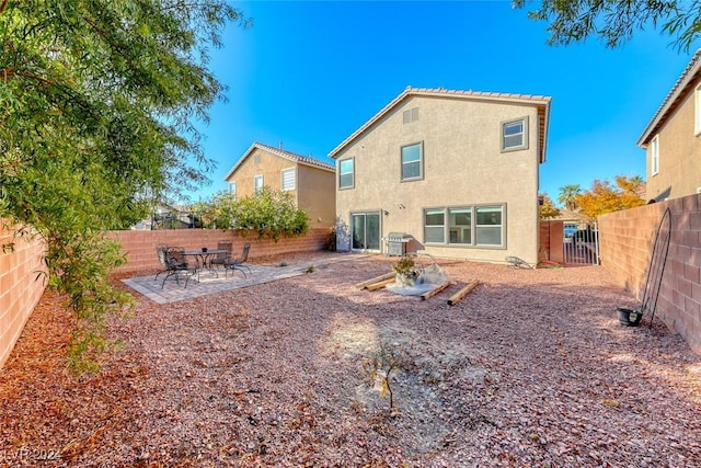 rear view of house featuring a patio area