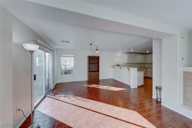 unfurnished living room featuring dark wood-type flooring