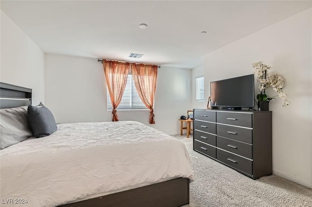 bedroom with light carpet