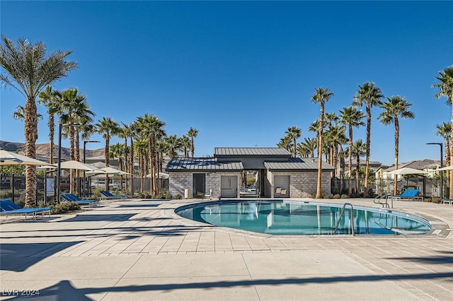 view of swimming pool featuring a patio