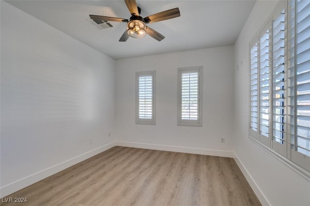 unfurnished room featuring ceiling fan and light wood-type flooring