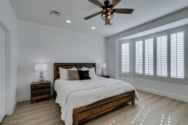 bedroom featuring ceiling fan and light hardwood / wood-style floors