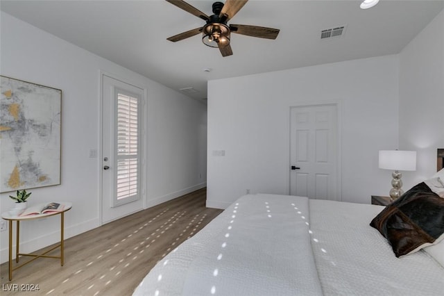 bedroom with ceiling fan and light wood-type flooring