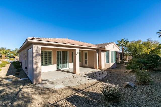 rear view of property with a patio area