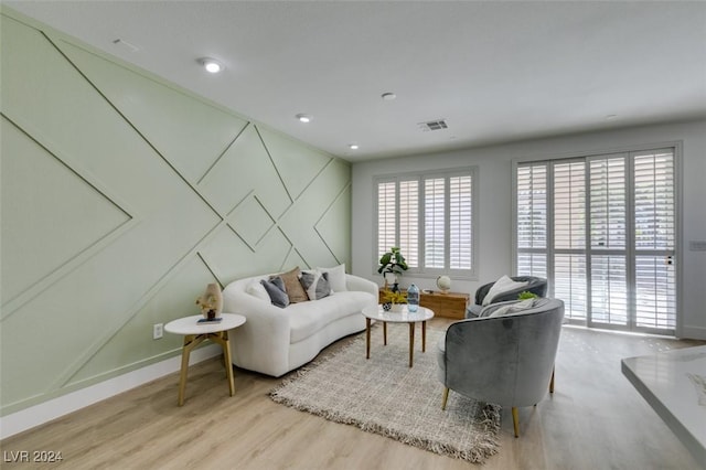 living room with a healthy amount of sunlight and light wood-type flooring