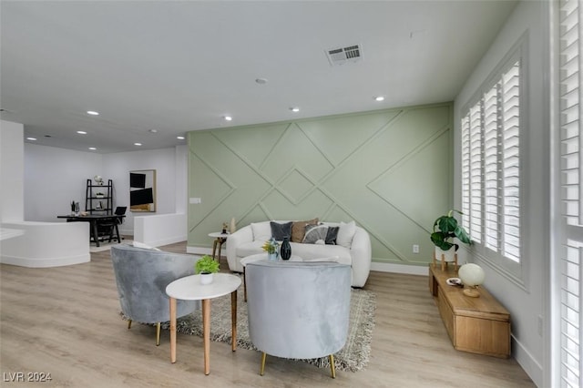 living room featuring plenty of natural light and light wood-type flooring