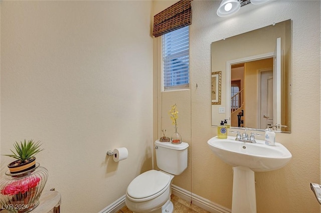 bathroom featuring tile patterned floors and toilet