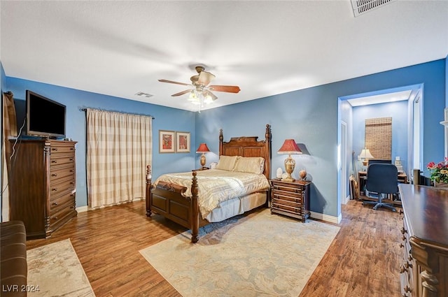 bedroom featuring ceiling fan and hardwood / wood-style floors