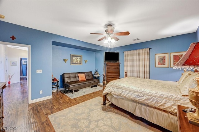 bedroom featuring ceiling fan and hardwood / wood-style floors