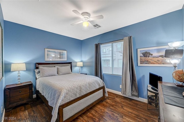 bedroom with ceiling fan and dark wood-type flooring